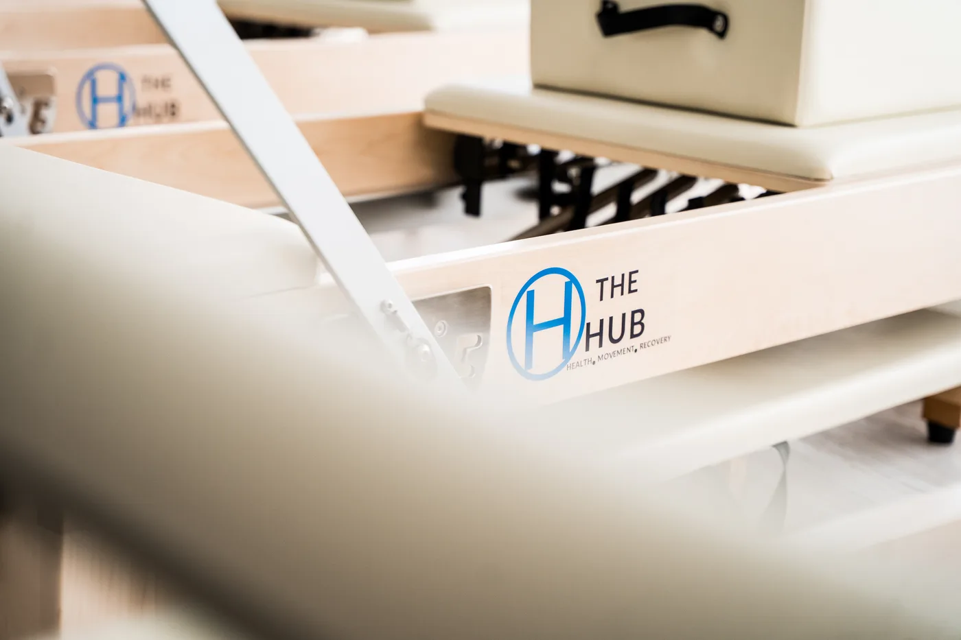 The Hub Reformer Pilates equipment and studio branding