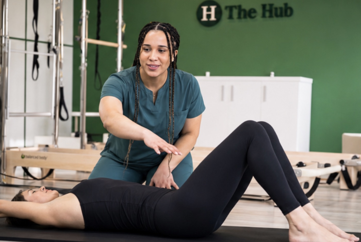 Mia teaching Reformer Pilates at The Hub Glasgow